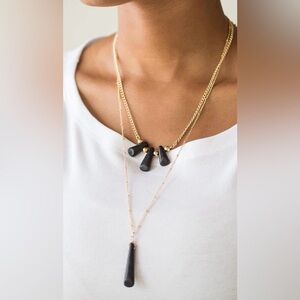 Gold layered necklace with black stone pendants